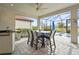 Covered patio with outdoor dining table and chairs, near the pool at 4534 Trento Pl, Bradenton, FL 34211