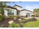 House exterior with gray garage and manicured landscaping at 4534 Trento Pl, Bradenton, FL 34211