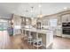 Modern kitchen featuring an island, stainless steel appliances, and white cabinetry at 4534 Trento Pl, Bradenton, FL 34211