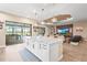 Open concept kitchen with large island, stainless steel appliances, and access to lanai at 4534 Trento Pl, Bradenton, FL 34211