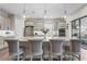 Island kitchen with seating, stainless steel appliances, and view to backyard at 4534 Trento Pl, Bradenton, FL 34211