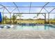 Resort-style pool with a covered lanai and tranquil water features at 4534 Trento Pl, Bradenton, FL 34211