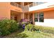 Landscaped courtyard with flowering bushes and a birdbath at 4550 Pinebrook Cir # 105, Bradenton, FL 34209