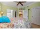 Bright bedroom with floral bedding and ensuite bathroom access at 4802 51St W St # 1304, Bradenton, FL 34210