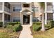 Inviting condo building entrance with landscaping and stairs at 4802 51St W St # 1304, Bradenton, FL 34210