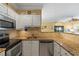 Updated kitchen with granite countertops and white cabinets at 4802 51St W St # 1304, Bradenton, FL 34210