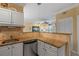 Granite countertop kitchen with stainless steel appliances at 4802 51St W St # 1304, Bradenton, FL 34210