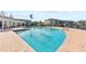 Resort-style pool with comfortable lounge chairs and shaded seating areas at 4802 51St W St # 1304, Bradenton, FL 34210