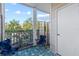 Relaxing screened porch with patio furniture and view of nature at 4802 51St W St # 1304, Bradenton, FL 34210