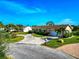 Home situated on a corner lot with a paver driveway at 5011 Mangrove Point Rd, Bradenton, FL 34210