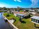 Aerial view of a home on the waterfront with a large sunroom at 5011 Mangrove Point Rd, Bradenton, FL 34210