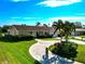 Attractive home with circular driveway and landscaping at 5011 Mangrove Point Rd, Bradenton, FL 34210