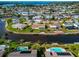 Aerial view of waterfront home with circular driveway and canal access at 5011 Mangrove Point Rd, Bradenton, FL 34210