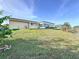 Large backyard with lush grass and a view of the house at 5011 Mangrove Point Rd, Bradenton, FL 34210