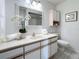 Clean and updated bathroom with a large vanity and shower at 5011 Mangrove Point Rd, Bradenton, FL 34210