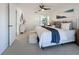 Spacious main bedroom with plush bedding and ample natural light at 5011 Mangrove Point Rd, Bradenton, FL 34210