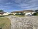 Well-maintained house exterior with a paver driveway at 5011 Mangrove Point Rd, Bradenton, FL 34210