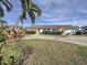 Single-story home with paved driveway and tropical landscaping at 5011 Mangrove Point Rd, Bradenton, FL 34210