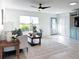 Bright living room with sofa, coffee table, and view of a door and built-in cabinet at 5011 Mangrove Point Rd, Bradenton, FL 34210