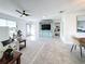 Open-concept living room with a view into the bedroom and dining area at 5011 Mangrove Point Rd, Bradenton, FL 34210