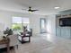 Spacious living room featuring a comfortable sofa and a large window at 5011 Mangrove Point Rd, Bradenton, FL 34210