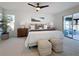 Spacious main bedroom with sliding doors leading to a private patio at 5011 Mangrove Point Rd, Bradenton, FL 34210