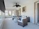 Bright sunroom features wicker furniture and relaxing canal views at 5011 Mangrove Point Rd, Bradenton, FL 34210