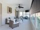 Bright sunroom features wicker furniture and relaxing canal views at 5011 Mangrove Point Rd, Bradenton, FL 34210
