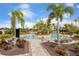 Community pool with lounge chairs and tropical landscaping at 5305 Greenbrook Dr, Sarasota, FL 34238