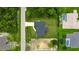Aerial view of a single-Gathering home with a large backyard and surrounding neighborhood at 5371 Fleming St, Port Charlotte, FL 33981
