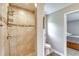 Shower with tile surround and adjacent toilet at 5371 Fleming St, Port Charlotte, FL 33981