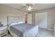 Bedroom with double doors and a wood-like bed frame at 5371 Fleming St, Port Charlotte, FL 33981