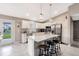 Modern kitchen featuring an island, stainless steel appliances, and granite countertops at 5371 Fleming St, Port Charlotte, FL 33981
