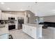 Open concept kitchen with island and stainless steel appliances at 5371 Fleming St, Port Charlotte, FL 33981