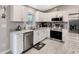 Modern kitchen with stainless steel appliances and granite countertops at 5371 Fleming St, Port Charlotte, FL 33981