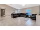 Spacious living room featuring a sectional sofa and tile floors at 5371 Fleming St, Port Charlotte, FL 33981