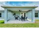 Covered patio with grill and outdoor seating at 5371 Fleming St, Port Charlotte, FL 33981