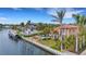 Aerial view of waterfront home with a pool and boat dock at 5376 Shadow Lawn Dr, Sarasota, FL 34242