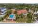 Aerial view of a two-story home with a pool and lush landscaping at 5376 Shadow Lawn Dr, Sarasota, FL 34242