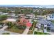 Property view showing a canal front home with lush landscaping at 5376 Shadow Lawn Dr, Sarasota, FL 34242