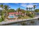 Aerial view of waterfront home with private pool and dock at 5376 Shadow Lawn Dr, Sarasota, FL 34242