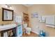 Clean bathroom with a single vanity, toilet, and decorative accents at 5376 Shadow Lawn Dr, Sarasota, FL 34242