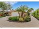 Landscaped front yard with a paved driveway and walkway leading to the home at 5376 Shadow Lawn Dr, Sarasota, FL 34242