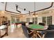 Game room with a pool table and poker table, ideal for entertainment at 5376 Shadow Lawn Dr, Sarasota, FL 34242