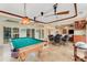 Spacious game room with pool table and seating area at 5376 Shadow Lawn Dr, Sarasota, FL 34242