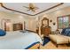 Bright main bedroom with a comfortable seating area at 5376 Shadow Lawn Dr, Sarasota, FL 34242