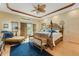 Main bedroom with king-size bed and access to a balcony at 5376 Shadow Lawn Dr, Sarasota, FL 34242