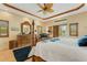 Main bedroom with king bed and ensuite bathroom at 5376 Shadow Lawn Dr, Sarasota, FL 34242