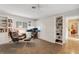 Bright office features built-in cabinetry and comfortable seating at 5376 Shadow Lawn Dr, Sarasota, FL 34242