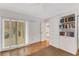 Home office with built-ins, sliding doors, and a view to the outdoors at 5376 Shadow Lawn Dr, Sarasota, FL 34242